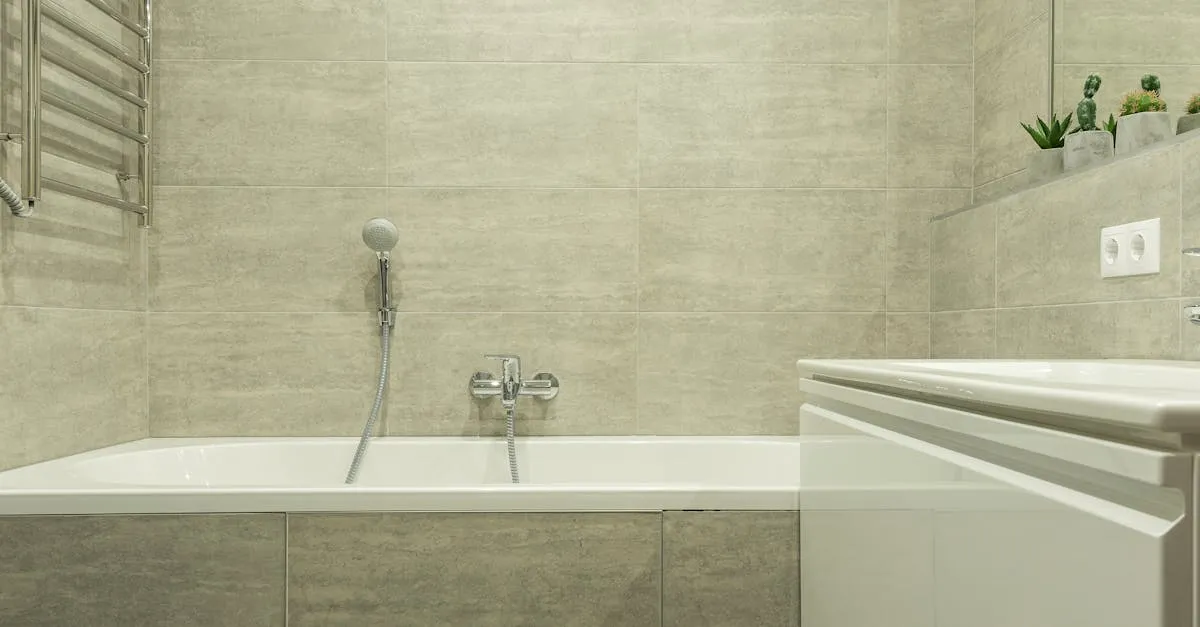 A clean and modern bathroom interior showcasing a ceramic bathtub and stylish tiles.